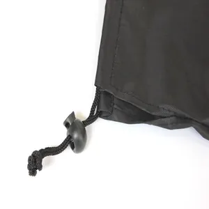 Close-up detail of black Oxford cloth storage bag with adjustable drawstring toggle