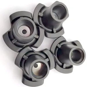Detail view of four durable black non-slip rubber replacement tips for underarm crutches.