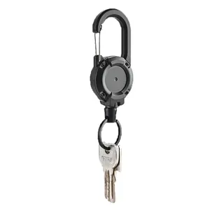 Detail view of a heavy-duty black retractable keychain featuring a tactical carabiner clip