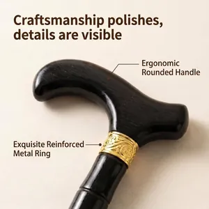 Close-up of ergonomic black wooden cane handle with gold reinforced ring