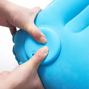 Blue portable inflatable pillow with built-in manual press pump for outdoor use
