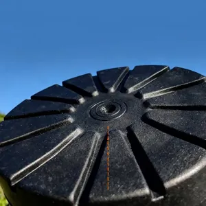 Detail view of anti-slip radial texture on black rubber crutch tip for walking sticks