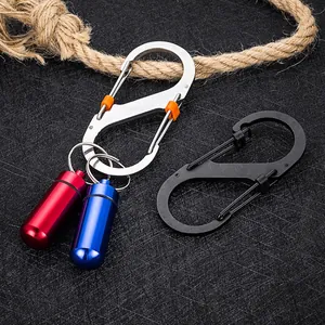 Macro view of heavy-duty S-shaped carabiners and mini colorful aluminum pill containers