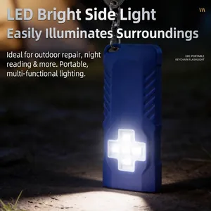 Detail van draagbare blauwe LED-sleutelhangerlamp met fel kruisvormig licht