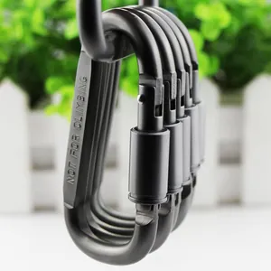 Detailansicht eines Aluminium-Karabiners mit Schraubverschluss und Warnhinweis