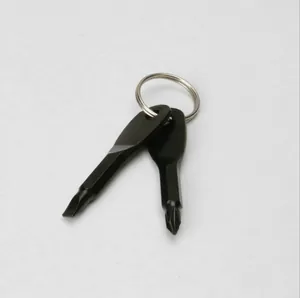 Close-up of black portable key-shaped EDC mini screwdriver set with flat and Phillips heads.