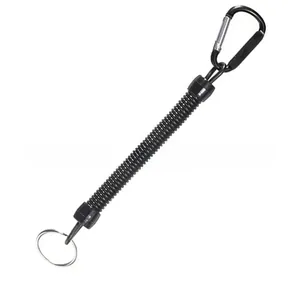 Detailed view showing the flexible black coiled structure of a retractable fishing lanyard