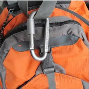 Close-up of 8cm silver aluminum D-ring carabiner with screw lock on orange backpack