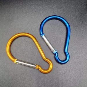 Close-up detail of blue and orange aluminum alloy bulb-shaped carabiners for outdoor camping