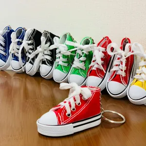 Colorful mini canvas sneaker keychain for bike kickstand or motorcycle decoration.