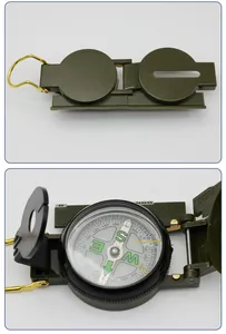 Macro view of military green folding compass dial with scale and directional markings