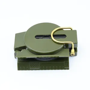 Close-up detail of army green plastic flip-cover portable camping and hiking compass