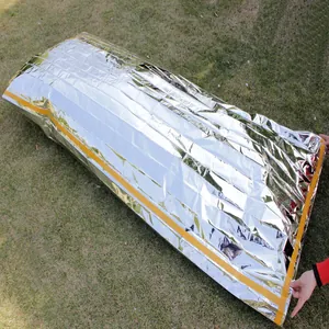 Outdoor emergency survival sleeping bag made of silver mylar thermal material.