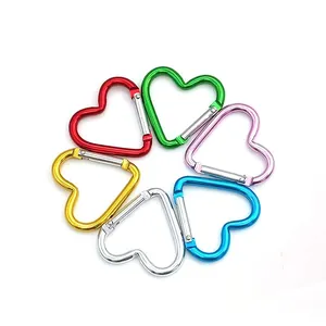 Close-up view of mini heart-shaped carabiners in six vibrant assorted colors.