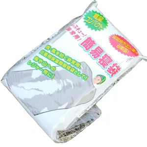 Silver aluminum thermal emergency sleeping bag in compact retail packaging for outdoor survival.