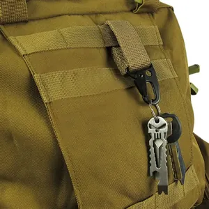 Close-up of tactical eagle beak hook attached to coyote brown webbing on a backpack