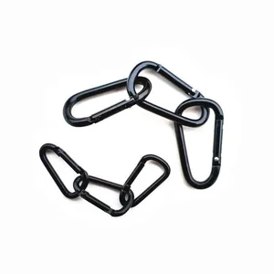 Set of black D-shaped aluminum alloy carabiners for outdoor climbing on white background
