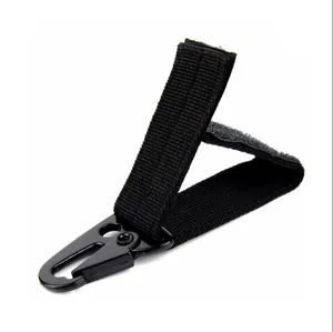 Close-up detail of durable black tactical nylon webbing strap with eagle beak metal hook