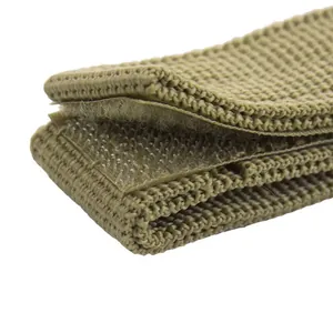 Close-up detail of durable tactical webbing strap with secure hook and loop fastener.