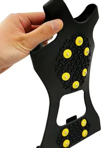 Detailed close-up showing durable black rubber ice cleats with yellow anti-slip studs for snow
