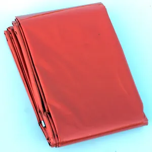 Compact orange emergency sleeping bag for outdoor camping, survival, and hiking