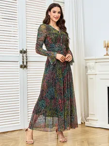 Full-length detail view of an elegant maxi dress with rhinestones and abstract print