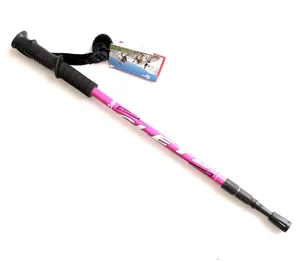 Detail view of pink 3-section telescopic trekking pole with ergonomic black grip