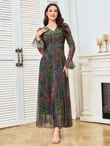 Elegant long-sleeved pleated maxi dress with colorful pattern and rhinestone accents