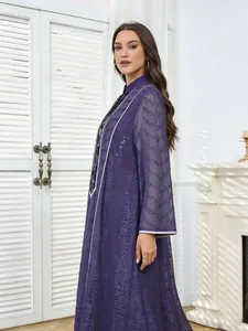 Detailed view of the purple ethnic dress featuring intricate embroidered mesh sleeves and sequins.