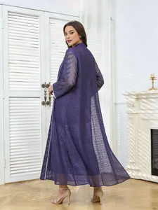 Detailed view of purple mesh long dress with sequin embroidery and ethnic beaded patterns.