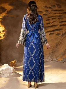 Detailed back view of blue Malaysia style robe with intricate embroidery and bow belt.