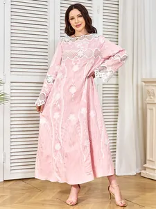Elegant pink long-sleeve dress with intricate white lace embroidery details for parties.