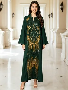 Full view of elegant dark green dress with heavy gold sequin butterfly embroidery