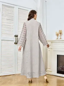 Back view of elegant long-sleeved mesh dress with intricate sequin embroidery detail