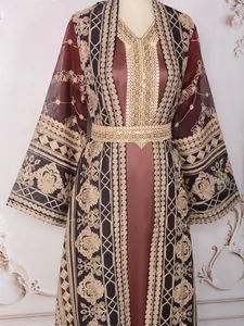 Close-up of elegant gold floral embroidery on a maroon two-piece Malaysian Abaya dress