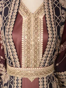 Close-up of elegant gold embroidery and sequins on brown ethnic robe detail