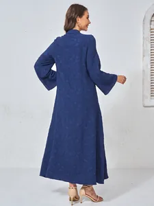 Back view of navy blue maxi dress with textured floral pattern and bell sleeve details