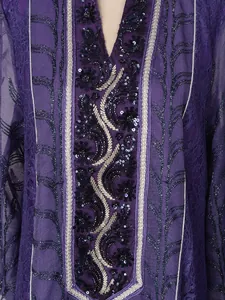 Close-up detail of ethnic purple dress with intricate sequin and bead embroidery