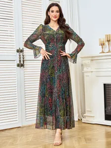 Full view of elegant floral maxi dress with shimmering texture in a home setting