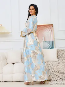 Elegant light blue and gold floral maxi dress with intricate beaded cuffs and waist tie