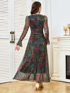 Back view of elegant pleated evening dress with colorful print and shimmering details