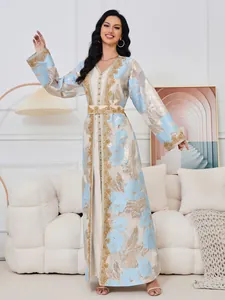 Full length elegant light blue kaftan dress with intricate gold embroidery and beading