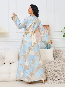 Elegant light blue floral maxi dress featuring gold beaded cuffs and a bow back detail
