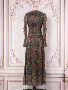 Elegant back view of shimmering multicolored maxi dress with rhinestone detailing.
