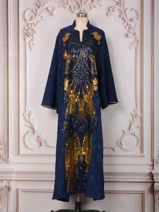 Detail of heavy gold sequin butterfly embroidery on elegant navy blue party dress.