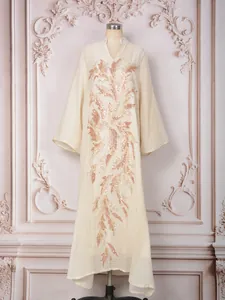 Full view of cream elegant banquet dress with rose gold sequin floral applique