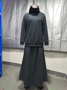 Minimalist black high neck sweatshirt and long skirt two-piece set shown on a mannequin