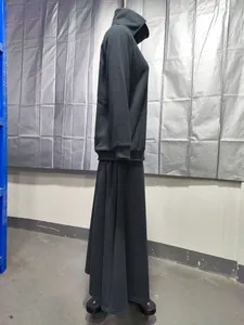 side view of a black fleece high-collar hoodie and long skirt set on a mannequin