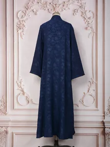 Back view of elegant navy blue floral jacquard long-sleeved maxi dress for women