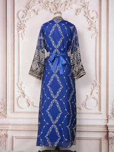 Back view of elegant royal blue Malaysian style embroidered long dress with bow